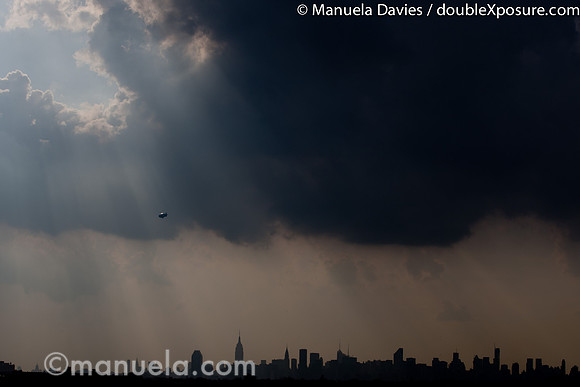Ambiance - clouds above New York skyline