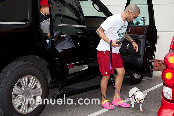 Miguel Cotto arrives at the Don Miguel Boxing Gym in Orlando with one of his French bulldogs