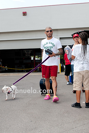 Miguel Cotto arrives at the Don Miguel Boxing Gym in Orlando with one of his French bulldogs