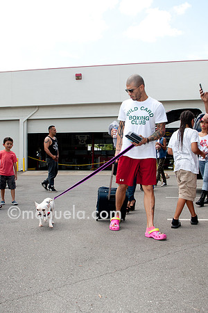 Miguel Cotto arrives at the Don Miguel Boxing Gym in Orlando with one of his French bulldogs