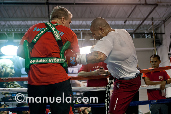 Miguel Cotto and trainer Freddie Roach prepare for the fight against Delvin Rodriguez on Oct 5