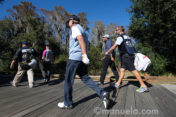 The Nelsons and Singhs on their way to the 9th tee