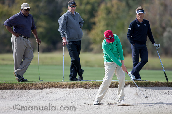 Bernhard Langer watches Amateur's bunker shot