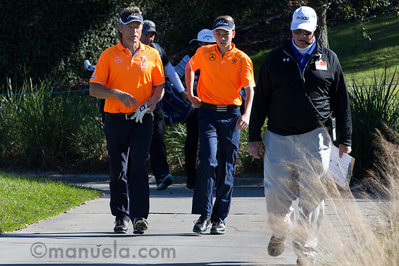 Bernhard and Jason Langer on their way to the 17th tee