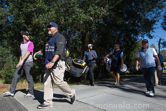 The Nelsons and Singhs on their way to the 9th tee