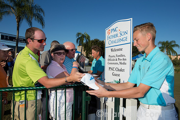Bernhard and Jason Langer signing autographs