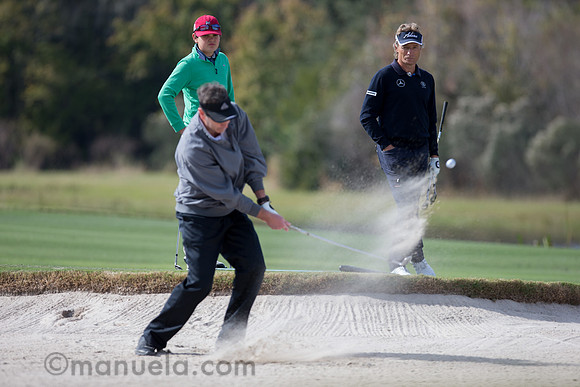 Bernhard Langer watches Amateur's bunker shot